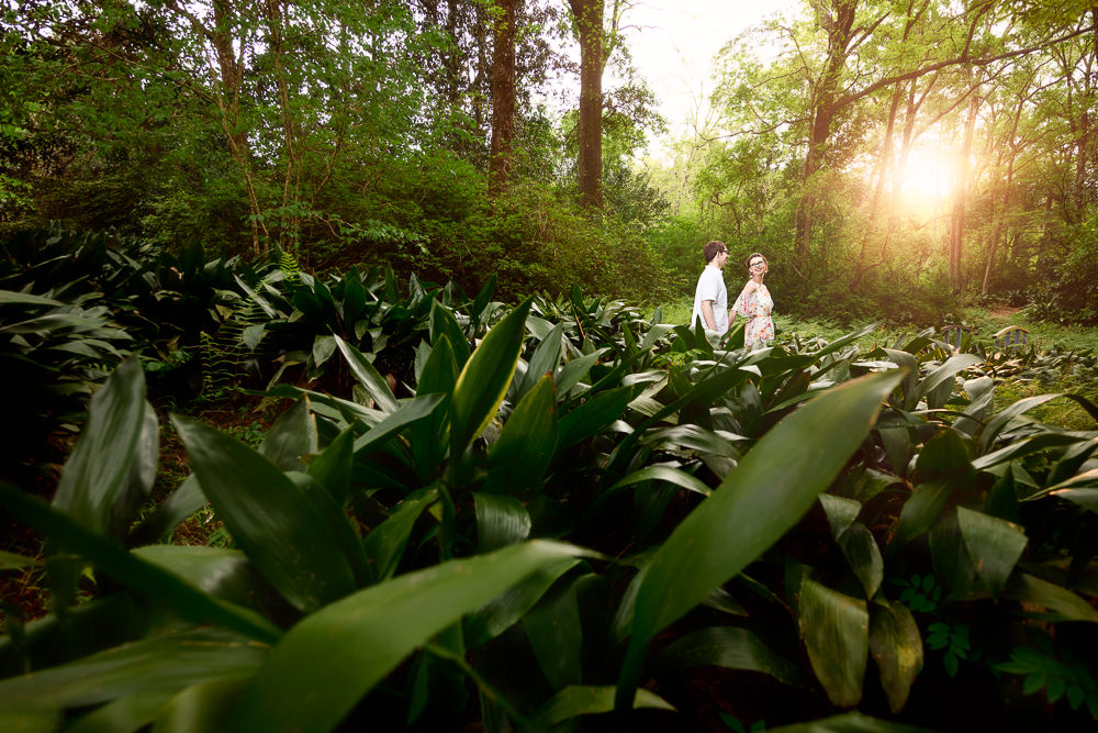 Woman leading her Fiance through a garden, Beautiful Mobile Botanical Gardens Engagement Session, Lazzat Photography