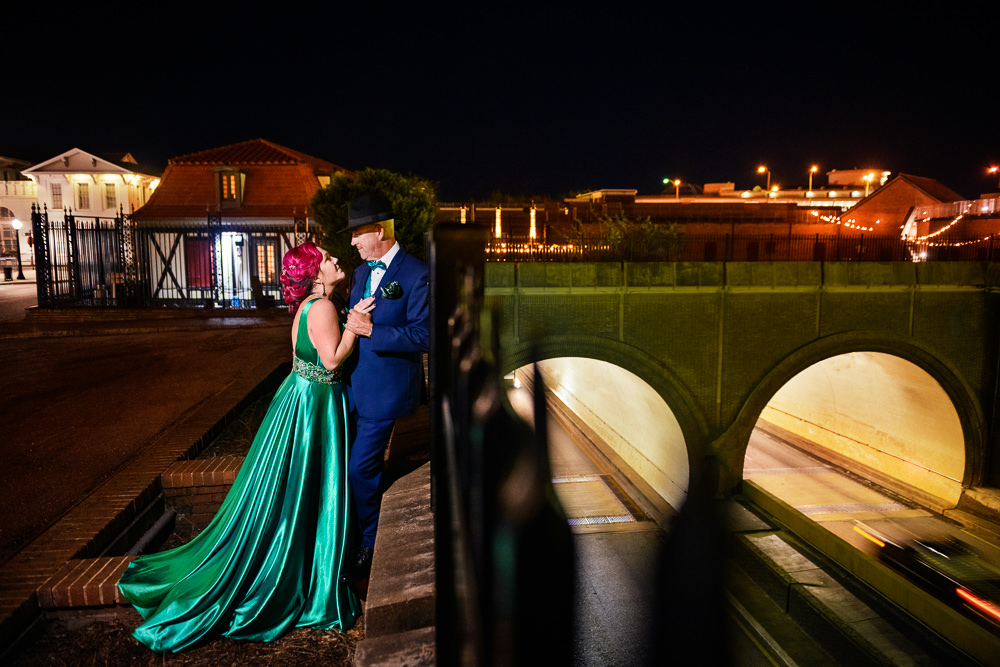 Couple leaning on the rail, green formal gown, pink hair, EPIC couple shoot, Lazzat Photography