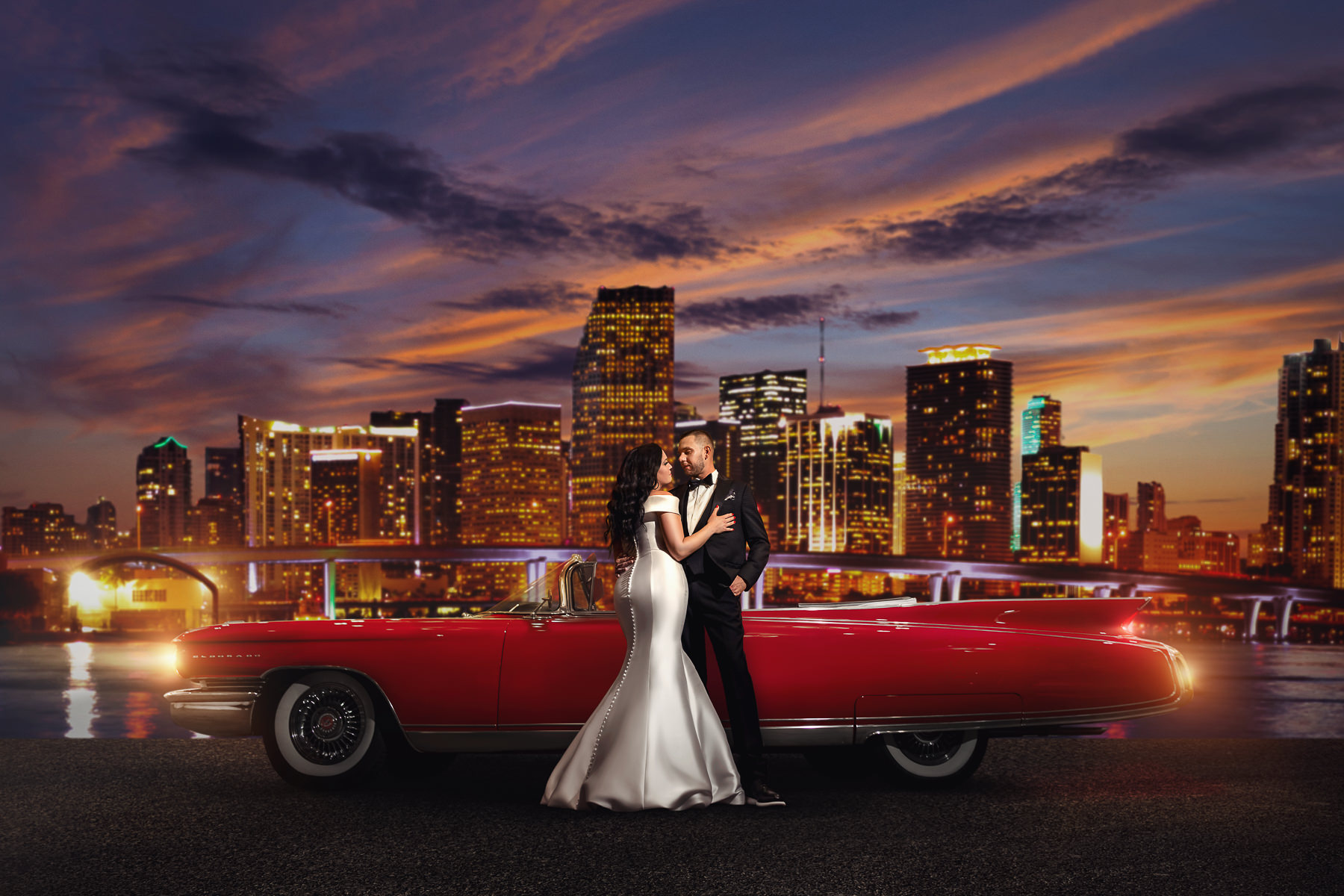 Grand Bohemian Hotel Orlando Wedding | bride and groom posing in front of classic car